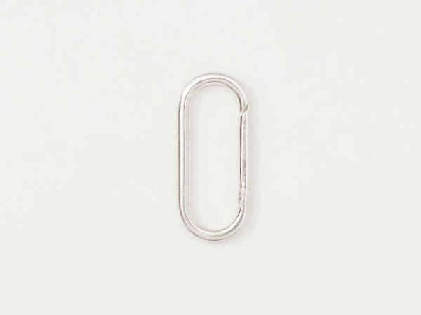 A small silver oval connector charm with a discreet hinge design on a white background.